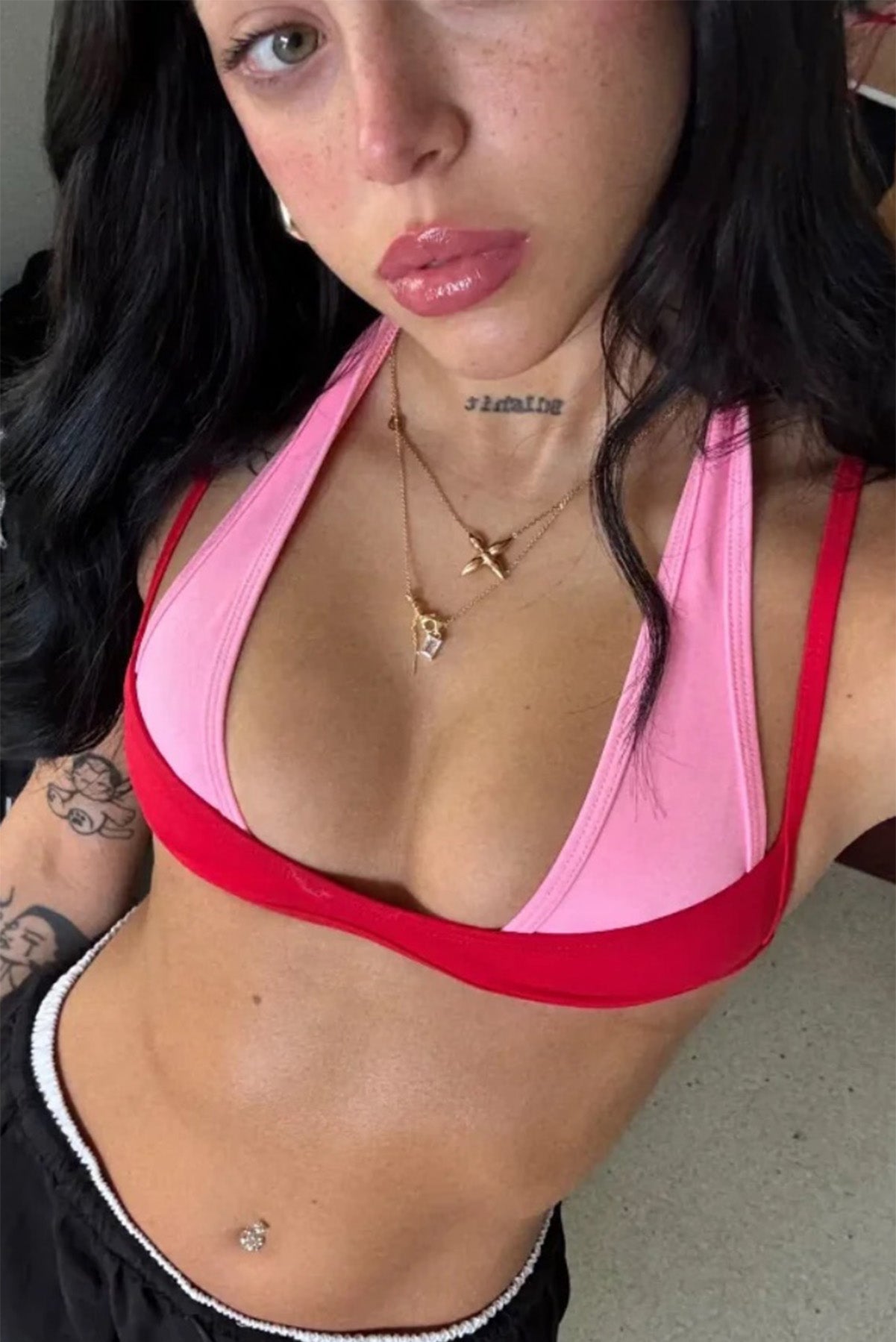 Nicki Nicole wearing our bikini tops. Combining the pink Brandon top with the red Aerin top.